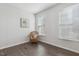 Bright office featuring hardwood flooring, white walls, and a decorative armchair at 232 Big Barn Dr, Wendell, NC 27591
