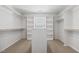 Large walk-in closet with built-in shelving and hanging rods at 232 Big Barn Dr, Wendell, NC 27591