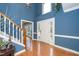 Bright entryway with soaring ceilings, hardwood floors, and classic trim details at 5205 Longwood Dr, Durham, NC 27713