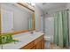 Bathroom features a vanity with a large mirror, a toilet, and a shower/tub combination with a curtain at 821 Stackhurst Way, Wake Forest, NC 27587