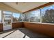 Covered screened porch with tile floor and views of the backyard at 821 Stackhurst Way, Wake Forest, NC 27587