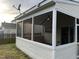 A view of the screened porch highlighting the indoor-outdoor living space at 821 Stackhurst Way, Wake Forest, NC 27587