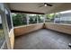Relaxing screened-in porch with ceiling fan, wood accents and tile flooring at 821 Stackhurst Way, Wake Forest, NC 27587