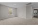 Bright bedroom featuring neutral walls, plush carpet, and a window offering natural light at 9184 Phoenix Ct, Middlesex, NC 27557