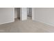 Neutral bedroom with carpet and an open closet area, with white baseboards at 9184 Phoenix Ct, Middlesex, NC 27557