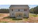 View of the rear of the property showcasing a covered patio area with wooden support beams at 9184 Phoenix Ct, Middlesex, NC 27557