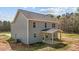 This new construction home features a covered back patio and gray vinyl siding at 9184 Phoenix Ct, Middlesex, NC 27557