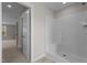 A bright white stand-up shower unit is presented from within a neutral-toned bathroom at 9184 Phoenix Ct, Middlesex, NC 27557
