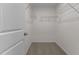Well-lit walk-in closet features ample wire shelving for storage and organization at 9184 Phoenix Ct, Middlesex, NC 27557