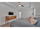 Main bedroom with king bed and wood floors at 1520 Rhodeschool Dr, Wendell, NC 27591