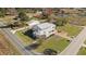 Aerial view shows a large property with a two-story house, detached garages, and spacious yards at 5311 Fairground Rd, Dunn, NC 28334