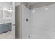 Bathroom featuring a shower with gray tiling and a vanity with a modern sink at 5311 Fairground Rd, Dunn, NC 28334