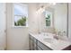 Bright bathroom with double sinks and a vanity with light fixtures at 853 Parc Townes Dr # 9, Wendell, NC 27591
