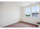 Bedroom featuring neutral carpet, light-filled windows with neighborhood view at 853 Parc Townes Dr # 9, Wendell, NC 27591