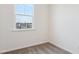Carpeted bedroom featuring a window overlooking a neighborhood at 853 Parc Townes Dr # 9, Wendell, NC 27591