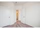 Bedroom with a closet and open door revealing an adjacent bathroom at 853 Parc Townes Dr # 9, Wendell, NC 27591