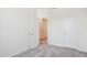 Neutral bedroom with carpet, white walls, and an open closet door at 853 Parc Townes Dr # 9, Wendell, NC 27591