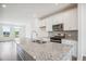 Modern kitchen with granite countertops and stainless steel appliances at 853 Parc Townes Dr # 9, Wendell, NC 27591