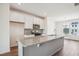 Bright kitchen featuring white cabinets and a granite island at 853 Parc Townes Dr # 9, Wendell, NC 27591
