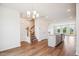 Open-concept living room with wood floors and stairway to the upper level at 853 Parc Townes Dr # 9, Wendell, NC 27591