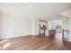 Open-concept living area flowing into a modern kitchen with a gray island and stainless steel appliances at 853 Parc Townes Dr # 9, Wendell, NC 27591