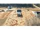 Aerial view of new home construction with a freshly seeded yard at 9154 Phoenix Ct, Middlesex, NC 27557