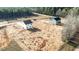 Aerial view of two new construction homes, each with driveway, on a large lot in a wooded neighborhood at 9154 Phoenix Ct, Middlesex, NC 27557