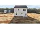 Backyard features a freshly seeded yard with the rear of the white house at 9154 Phoenix Ct, Middlesex, NC 27557