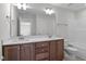 Bright bathroom featuring double sink vanity with shaker cabinets at 9154 Phoenix Ct, Middlesex, NC 27557