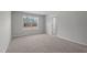 Bedroom featuring neutral carpeting and a large window providing plenty of natural light at 9154 Phoenix Ct, Middlesex, NC 27557
