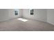 Bedroom with carpet and two windows at 9154 Phoenix Ct, Middlesex, NC 27557