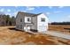 Two-story home with vinyl siding, attached garage, and new landscaping on a sunny day at 9154 Phoenix Ct, Middlesex, NC 27557