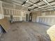 Unfinished garage with open door to the outside at 9154 Phoenix Ct, Spring Hope, NC 27882