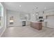 Modern kitchen featuring a center island, stainless steel appliances, and light gray cabinets at 9154 Phoenix Ct, Middlesex, NC 27557