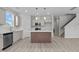 Modern kitchen featuring a center island, stainless steel appliances, and light gray cabinetry at 9154 Phoenix Ct, Middlesex, NC 27557