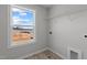 Bright laundry room features a window and hookups for washer and dryer at 9154 Phoenix Ct, Middlesex, NC 27557
