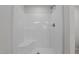 Clean white tiled shower with showerhead and faucet at 9154 Phoenix Ct, Middlesex, NC 27557