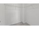Walk-in closet boasts carpet flooring, white walls and metal shelving at 9154 Phoenix Ct, Middlesex, NC 27557