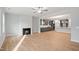 Bright living room showcasing a fireplace that looks into the kitchen area at 1009 Bostonian Dr, Knightdale, NC 27545