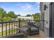 A balcony featuring chairs, table and a great view at 10529 Pleasant Branch Dr # 201, Raleigh, NC 27614