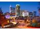 Striking city skyline view at night with vibrant lights and buildings, near main roads at 10529 Pleasant Branch Dr # 201, Raleigh, NC 27614