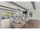 Bright living room with a fireplace, modern furniture, neutral color palette, wood-look floors, and an outdoor balcony at 10529 Pleasant Branch Dr # 201, Raleigh, NC 27614