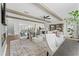 Open living space features stylish seating, exposed beams, and a view of the modern kitchen and dining areas at 10529 Pleasant Branch Dr # 201, Raleigh, NC 27614