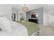 Bright main bedroom with neutral carpet, contemporary lighting, accent wall, and modern decor at 10531 Pleasant Branch Dr # 101, Raleigh, NC 27614