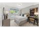 Cozy bedroom with natural light, neutral colors, and comfortable decor at 10531 Pleasant Branch Dr # 101, Raleigh, NC 27614