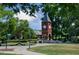 Charming clock tower on a meticulously landscaped green space with walking paths and inviting benches at 10531 Pleasant Branch Dr # 101, Raleigh, NC 27614