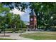 Charming clock tower on a meticulously landscaped green space with walking paths and inviting benches at 10531 Pleasant Branch Dr # 101, Raleigh, NC 27614