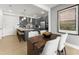Modern kitchen and dining area with gray cabinets, stainless steel appliances, and ample counter space at 10531 Pleasant Branch Dr # 101, Raleigh, NC 27614