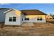 Exterior showcasing the back of the house, featuring a patio space and gray vinyl siding at 1064 Fairhaven Dr # 95, Mebane, NC 27302