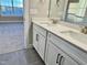 Bright bathroom featuring a double sink vanity with white cabinets and light countertops at 1064 Fairhaven Dr # 95, Mebane, NC 27302